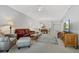 Spacious living room with open floor plan and a view of the kitchen at 5240 Hyland Hills Ave # 1411, Sarasota, FL 34241