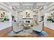 Elegant lobby with comfortable seating, fireplace, and hardwood floors at 5240 Hyland Hills Ave # 1411, Sarasota, FL 34241
