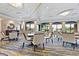Relaxing lounge area with comfortable seating and views of the golf course at 5240 Hyland Hills Ave # 1411, Sarasota, FL 34241