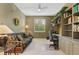 Home office with built-in shelving and a comfortable sofa at 5240 Hyland Hills Ave # 1411, Sarasota, FL 34241