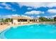 Inviting community pool with plenty of deck space for sunbathing at 5240 Hyland Hills Ave # 1411, Sarasota, FL 34241