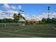 Tennis courts with a covered seating area at 5240 Hyland Hills Ave # 1411, Sarasota, FL 34241
