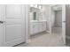 Clean bathroom with double vanity and neutral color palette at 5587 Farmington Ave, North Port, FL 34288