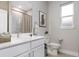 Bathroom with white vanity and toilet at 5587 Farmington Ave, North Port, FL 34288