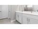 Modern bathroom with double vanity and a walk-in shower at 5587 Farmington Ave, North Port, FL 34288