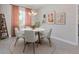 Elegant dining room with a round table and modern art at 5587 Farmington Ave, North Port, FL 34288