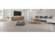 Spacious living room with comfortable seating and large TV at 5587 Farmington Ave, North Port, FL 34288