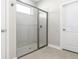 Large walk-in shower with gray tile at 5587 Farmington Ave, North Port, FL 34288
