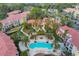 Aerial view of community pool and surrounding buildings at 5700 Bentgrass Dr # 16-211, Sarasota, FL 34235