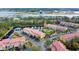 Aerial view of community, showing buildings and landscaping at 5700 Bentgrass Dr # 16-211, Sarasota, FL 34235