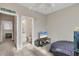 Bedroom with a TV, small bed and access to a bathroom and another room at 5700 Bentgrass Dr # 16-211, Sarasota, FL 34235