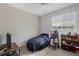 Bedroom with a TV, small bed and a bookshelf at 5700 Bentgrass Dr # 16-211, Sarasota, FL 34235