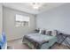 Spacious bedroom with ceiling fan and gray walls at 5700 Bentgrass Dr # 16-211, Sarasota, FL 34235