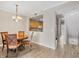 Dining room with wood table and chairs at 5700 Bentgrass Dr # 16-211, Sarasota, FL 34235