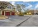 Two-story townhome with attached garage and landscaping at 5700 Bentgrass Dr # 16-211, Sarasota, FL 34235