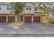 Townhome with attached garage and landscaping at 5700 Bentgrass Dr # 16-211, Sarasota, FL 34235