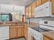 Updated kitchen with granite countertops and stainless steel sink at 5700 Bentgrass Dr # 16-211, Sarasota, FL 34235