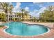 Inviting community pool with lounge chairs at 5700 Bentgrass Dr # 16-211, Sarasota, FL 34235