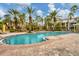 Inviting community pool with lounge chairs at 5700 Bentgrass Dr # 16-211, Sarasota, FL 34235