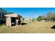 Large backyard with a dilapidated shed at 5808 2Nd W St, Bradenton, FL 34207