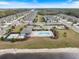 Aerial view of community pool and lake at 6077 Amberly Dr, Bradenton, FL 34208