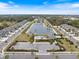 Aerial view of community with lake at 6077 Amberly Dr, Bradenton, FL 34208