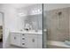Elegant bathroom with double vanity, large shower, and built-in bench at 6077 Amberly Dr, Bradenton, FL 34208