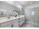 Spa-like bathroom featuring a double vanity, large shower, and a separate toilet area at 6077 Amberly Dr, Bradenton, FL 34208