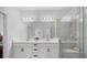 Bathroom with double vanity, large shower and linen closet at 6077 Amberly Dr, Bradenton, FL 34208