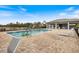 Community pool with lounge chairs at 6077 Amberly Dr, Bradenton, FL 34208
