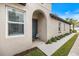Inviting front entrance with a walkway and landscaping at 6077 Amberly Dr, Bradenton, FL 34208
