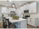 Modern kitchen with white cabinets and stainless steel appliances at 6077 Amberly Dr, Bradenton, FL 34208