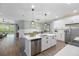Open concept kitchen features a large island, stainless steel appliances, and views to the Gathering room at 6077 Amberly Dr, Bradenton, FL 34208