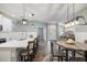 Modern kitchen with white cabinets, quartz countertops, and island at 6077 Amberly Dr, Bradenton, FL 34208