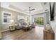 Open living area with hardwood floors and sliding glass doors at 6077 Amberly Dr, Bradenton, FL 34208