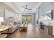 Spacious living area with hardwood floors and a view of the backyard at 6077 Amberly Dr, Bradenton, FL 34208