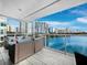Spacious balcony with water views and city skyline at 650 Golden Gate Pt # 401, Sarasota, FL 34236