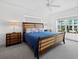 King-size bed, nightstands and large window with city view at 650 Golden Gate Pt # 401, Sarasota, FL 34236