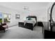 King-size bed, large windows and ceiling fan in bedroom at 650 Golden Gate Pt # 401, Sarasota, FL 34236