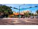 City street corner with shops and pedestrians at 650 Golden Gate Pt # 401, Sarasota, FL 34236