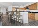 Modern kitchen with wood cabinets and granite countertops at 650 Golden Gate Pt # 401, Sarasota, FL 34236