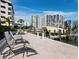 Unwind in comfort on these lounge chairs by the water at 650 Golden Gate Pt # 401, Sarasota, FL 34236