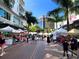Outdoor market with various vendors at 650 Golden Gate Pt # 401, Sarasota, FL 34236