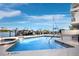 Community pool with hot tub and marina view at 650 Golden Gate Pt # 401, Sarasota, FL 34236