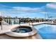 Relaxing resort-style pool and hot tub with marina views at 650 Golden Gate Pt # 401, Sarasota, FL 34236