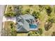 Aerial view of single-Gathering home with pool and lush landscaping at 6702 Pinehurst Pl, Bradenton, FL 34202