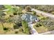 Single-Gathering home with a green roof and pool, near a golf course at 6702 Pinehurst Pl, Bradenton, FL 34202