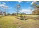 Landscaped backyard with golf course view at 6702 Pinehurst Pl, Bradenton, FL 34202