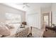 Bright bedroom with a queen bed, large closet, and access to a private bathroom at 6702 Pinehurst Pl, Bradenton, FL 34202