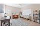 Home office with desk, chair, large window and bookshelves at 6702 Pinehurst Pl, Bradenton, FL 34202